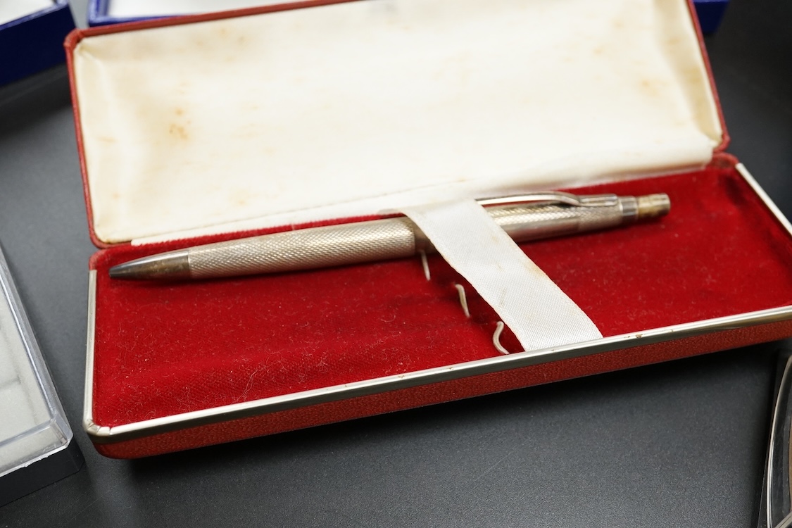 Four assorted cased Waterman pens, elven other assorted pens including Scheaffer and Parker and an engine turned silver pen.